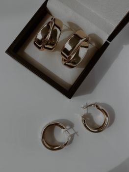 Home Stylish gold hoop earrings elegantly displayed in an open jewelry box, ideal for fashion enthusiasts.